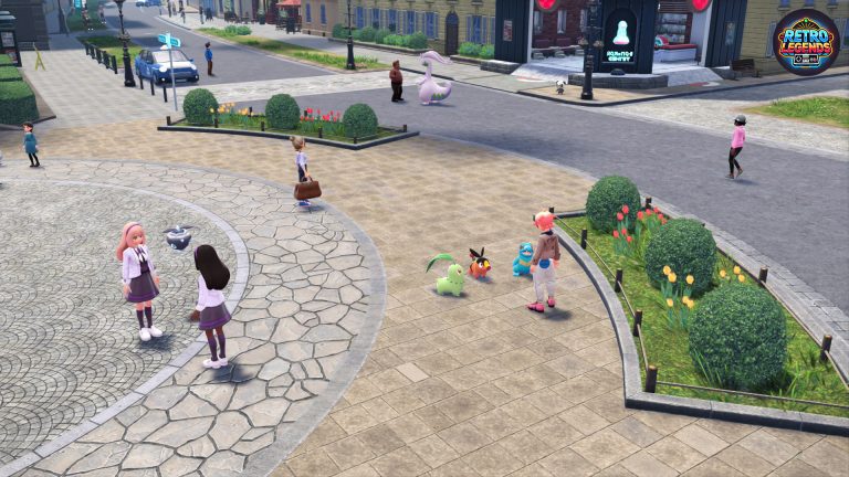 Straßenszene in Lumiose City aus Pokémon Legenden Z-A: Mehrere Trainer unterhalten sich auf einem Platz, während verschiedene Pokémon – darunter Chikorita, Tepig, Totodile und Goodra – frei umherlaufen. Im Hintergrund sieht man Cafés, Wohnhäuser und blühende Tulpenbeete. Die Darstellung zeigt, wie lebendig und detailreich die Stadt wirkt, mit spielenden Pokémon, Passanten und typischer Kalos-Architektur.